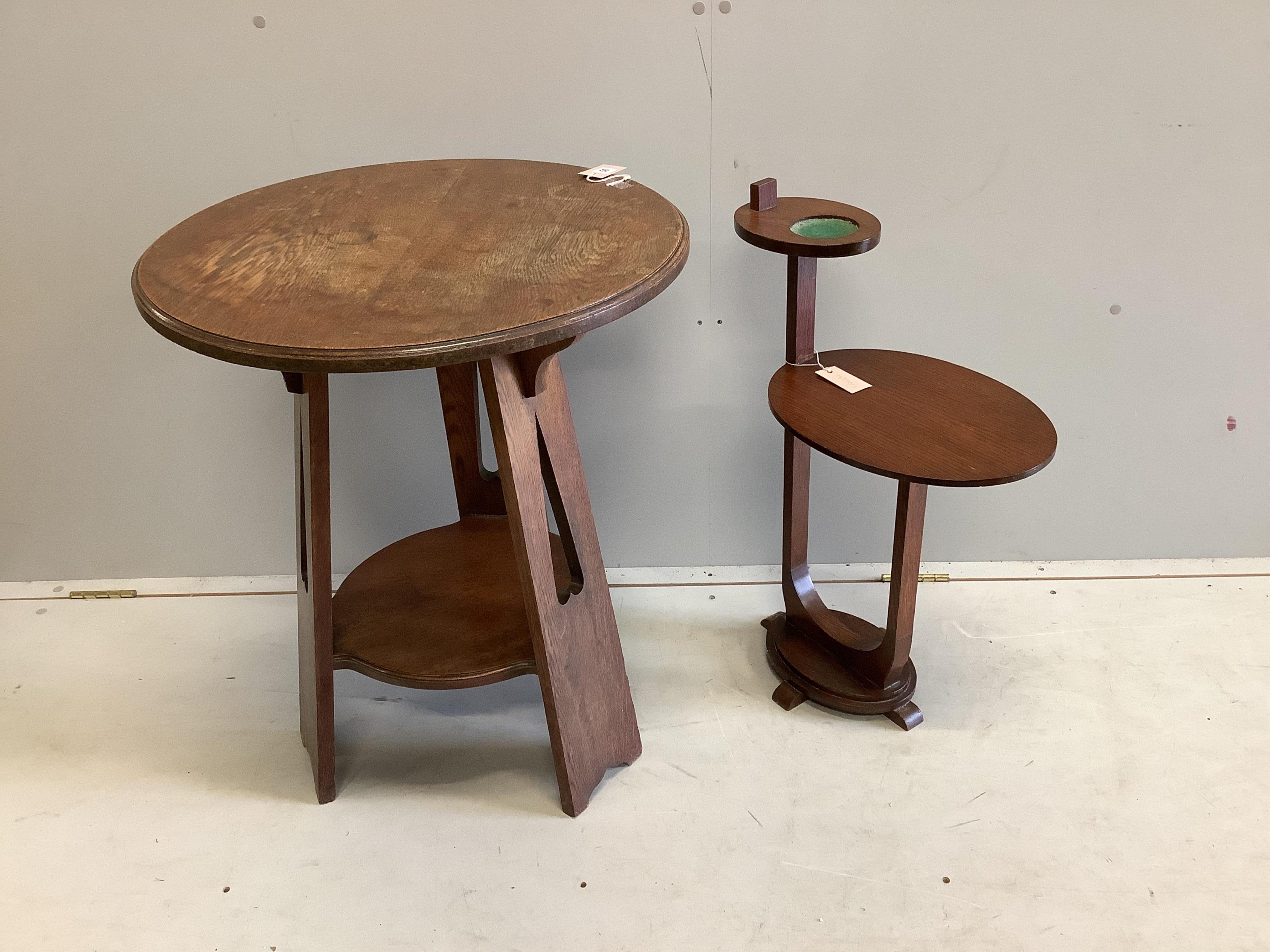 An early 20th century Liberty style circular oak occasional table, diameter 60cm, height 72cm. Condition - fair, top water stained together with a two tier smokers stand.